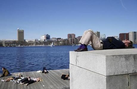 The Charles River Esplanade drew sunbathers taking advantage of the warmer temperatures on Sunday. 

