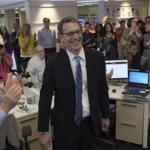 Members of the Washington Post staff congratulated David Fahrenthold (center) upon learning that he won the Pulitzer Prize for national reporting.