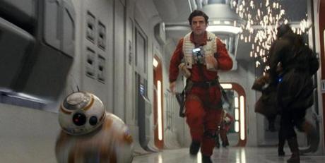 Oscar Isaac as Poe Dameron is just a few steps behind droid BB-8 as they escape a sparking hallway. 
