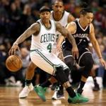 Boston MA 4/10/17 Boston Celtics Isaiah Thomas spin dribbles away from Brooklyn Nets Jeremy Lin during second quarter action at TD Garden. (Photo by Matthew J. Lee/Globe staff) topic: reporter: 