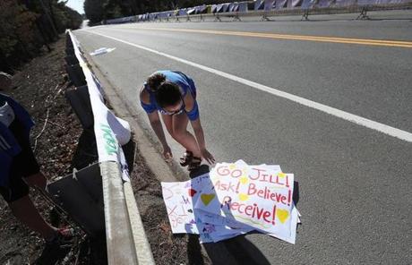 SLIDER IAMGE -- Wellesley, MA., 04/17/17, Wellesley College sophomore Jules Koury, cq, sets up signs for the scream tunnel in advance of the 121st running of the Boston Marathon. Globe staff/Suzanne Kreiter
