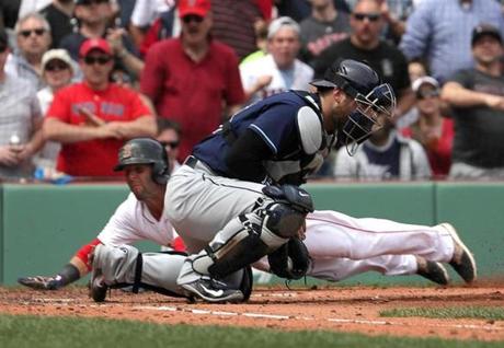 Boston, MA - 4/17/2017 - (2nd inning) Boston Red Sox second baseman Dustin Pedroia (15) scores ahead of the tag for a run in the second inning. The Boston Red Sox host the Tampa Bay Rays in the final game of a four game series at Fenway Park. - (Barry Chin/Globe Staff), Section: Sports, Reporter: Peter Abraham, Topic: 18Red Sox-Rays, LOID: 8.3.2221607101.

