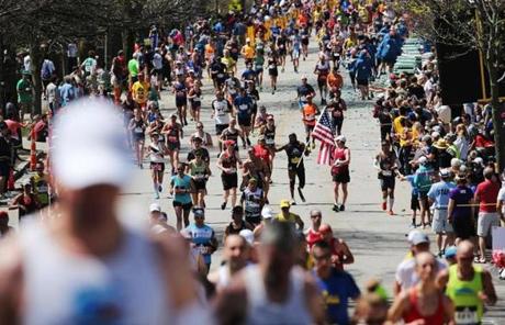slider Newton, MA- April 17, 2017: Runners begin their climb up Heartbreak Hill on Commonwealth Avenue in Newton, MA, on April 17, 2017. It is the 121st running of the Boston Marathon, a 26.2-mile journey from Hopkinton to Copley Square. (Globe staff photo / Craig F. Walker) section: metro reporter
