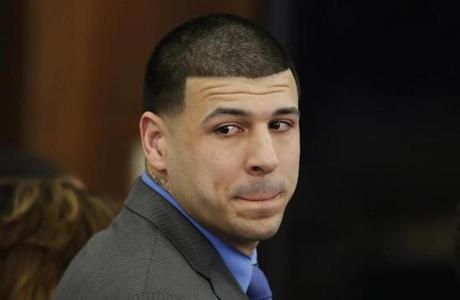 FILE - In this Friday, April 14, 2017, file photo, Former New England Patriots tight end Aaron Hernandez turns to look in the direction of the jury as he reacts to his double murder acquittal at Suffolk Superior Court in Boston. Hernandez hung himself and was pronounced dead at a Massachusetts hospital early Wednesday, April 19, 2017, according to officials. (AP Photo/Stephan Savoia, Pool, File)
