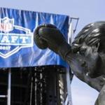 The Rocky statue stands in view of the stage being constructed for the 2017 NFL Draft in Philadelphia.