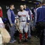 Second baseman Dustin Pedroia made his way through the dugout after he injured his left leg Friday night.