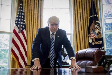 President Donald Trump poses for a portrait in the Oval Office in Washington, Friday, April 21, 2017. With his tweets and his bravado, Trump is putting his mark on the presidency in his first 100 days in office. He's flouted conventions of the institution by holding on to his business, hiring family members as advisers and refusing to release his tax returns. He's tested conventional political wisdom by eschewing travel, church, transparency, discipline, consistency and decorum. But the presidency is also having an impact on Trump, prompting him, at times, to play the role of traditional president. (AP Photo/Andrew Harnik)
