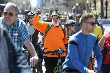 On Boylston Street Sunday, Jim Tozza, of Saugus, danced on his bike to piped music.
