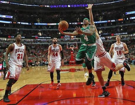 Chicago IL 4/23/17 Boston Celtics Isaiah Thomas scores a layup spliting the Chicago Bulls defense during second half action of game 4 of the first round of the NBA Playoffs at the United Center. (Photo by Matthew J. Lee/Globe staff) topic: reporter: 
