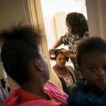 Kimberly Donald combed the hair of her daughter Janell Brooks in Racine, Wis. Donald said she?s doubtful the program would accurately identify drug users.