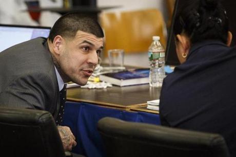 Aaron Hernandez conferred with one of his attorneys in court on March 2.
