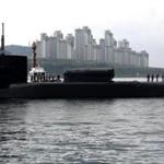 In this image released by the Navy, the guided-missile submarine USS Michigan was greeted as it arrived in Busan, South Korea, for a scheduled port visit Tuesday.