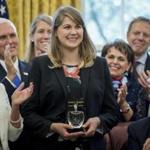 President Donald Trump, right, accompanied by Vice President Mike Pence, second from left, and his wife Karen, left, applauded after recognizing 2017 National Teacher of the Year award to Codman Academy 9th grade humanities teacher Sydney Chaffee. 