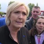 Far-right French presidential candidate Marine Le Pen is greeted by workers outside a whirlpool home appliance factory in Amiens, France, Wednesday April 26, 2017. While her centrist presidential opponent Macron was meeting with union leaders from the Whirlpool plant in northern France, Le Pen popped up outside the factory itself, amid its workers and declared herself the candidate of France's workers.(AP Photo)