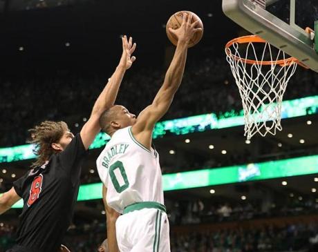 Boston MA 4/26/17 Boston Celtics Avery Bradley scores a layup beating Chicago Bulls Robin Lopez during first quarter action of game 5 of the NBA Playoffs at TD Garden. (Photo by Matthew J. Lee/Globe staff) topic: reporter:
