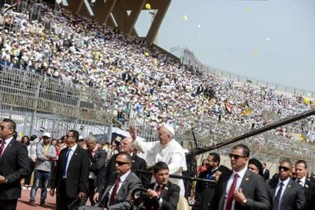 epa05934984 Pope Francis arrives to lead a mass at the Air Defense Stadium in Cairo, Egypt, 29 April 2017. Pope Francis is leading a mass in the Air defense stadium attended by 30 thousand people north-east of Cairo on the second day of his two-day visit to Cairo. A day earlier he met with Egyptian President Abdel Fattah al-Sisi, head of the Coptic Orthodox Church Pope Tawadros II, and Grand Imam of al-Azhar Ahmed al-Tayeb. Pope Francis historic visit to the Arab and Muslim majority nation aimed at presenting a united Christian-Muslim front to repudiate violence committed in God's name. EPA/MOHAMED HOSSAM
