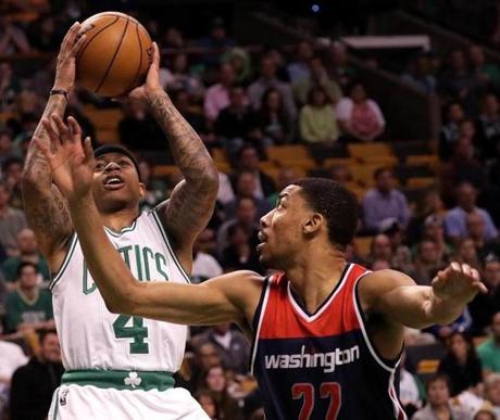 Boston, MA - 4/30/2017 - (1st quarter) Boston Celtics guard Isaiah Thomas (4) puts up a shot over Washington Wizards forward Otto Porter Jr. (22) during the first quarter. The Boston Celtics host the Washington Wizards in Game 1 of the Eastern Conference Semi-Finals at TD Garden. - (Barry Chin/Globe Staff), Section: Sports, Reporter: Adam Himmelsbach, Topic: 01Celtics-Wizards, LOID: 8.3.2343214657.
