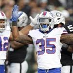 Buffalo Bills running back Mike Gillislee (35) celebrates after scoring a touchdown against the Oakland Raiders during the first half of an NFL football game in Oakland, Calif., Sunday, Dec. 4, 2016. (AP Photo/D. Ross Cameron)