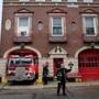 Firefighter James Kenney directed traffic as Engine 50 returns to the firehouse in Charlestown last week.