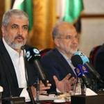 Exiled chief of Hamas's political bureau Khaled Meshaal (left) spoke during a conference in the Qatari capital of Doha on Monday.