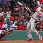 Boston, MA May 2, 2017: The Orioles Manny Machado ducks out of the way of a top of the first inning pitch from Red Sox starter Chris Sale that prompted a warning to both teams by home plate umpire D.J. Reyburn. The Boston Red Sox hosted the Baltimore Orioles in a regular season MLB base ball game at Fenway Park. (Globe Staff Photo/Jim Davis) 