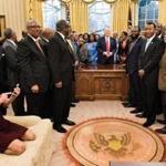 (FILES) Counselor to the President Kellyanne Conway (L) checks her phone after taking a photo as US President Donald Trump and leaders of historically black universities and colleges pose for a group photo in the Oval Office of the White House before a meeting with US Vice President Mike Pence February 27, 2017 in Washington, DC. While the new US president has shown a capacity to change, both his tone and his positions, he has been unable to show the world a 