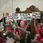 Women affiliated with Code Pink protesed during a confirmation hearing for Sen. Jeff Sessions on Capitol Hill in January. Desiree Fairooz, at center behind sign, was convicted of disorderly conduct and demonstrating on Capitol grounds.