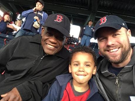 This is (right to left) Calvin Hennick, his six-year-old son, Nile, and Hennick's father in law, Guy Mont-Louis. They were attending Tuesday night's game at Fenway Park..
