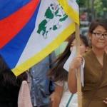05umassamherst - UMass Amherst student Kalsang Nangpa, with the Tibetan flag. (handout)