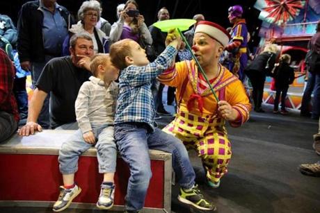 Clown Ivan Vargas showed Nathan Harrington, of Duxbury, how to spin a ball before Saturday?s performance in Providence.
