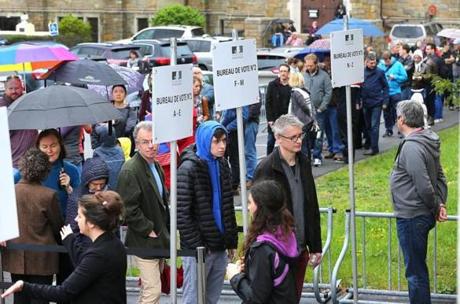French expatriates lined up at the International School of Boston to vote for the country?s president.
