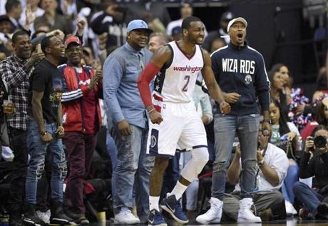 Washington Wizards guard John Wall (2) reacts during the second half in Game 4 of a second-round NBA basketball playoff series against the Boston Celtics, Sunday, May 7, 2017, in Washington. (AP Photo/Nick Wass)
