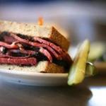 A pastrami sandwich served with a side of pickles at Katz's Delicatessen in New York. 