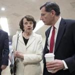 California Democratic Senator Dianne Feinstein, center, and Republican from Wyoming John Barrasso, right, walk together to the Senate chamber before a vote on Capitol Hill in Washington, DC, on Wednesday.  