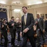 In this file photo from Monday, March 20, 2017, FBI Director James Comey takes a break after three hours of testifying as the House Permanent Select Committee on Intelligence holds its first public hearing on allegations of Russian interference in the 2016 U.S. presidential election and the murky web of contacts between President Donald Trump's campaign and Russia, on Capitol Hill in Washington. In the days before his firing by President Donald Trump on Tuesday, May 9, 2017, Comey told members of Congress he had asked the Justice Department for more resources to pursue the bureau's investigation into Russia's interference in last year's presidential election, three U.S. officials said Wednesday. (AP Photo/J. Scott Applewhite, file)