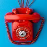 top view of red vintage phone on blue background