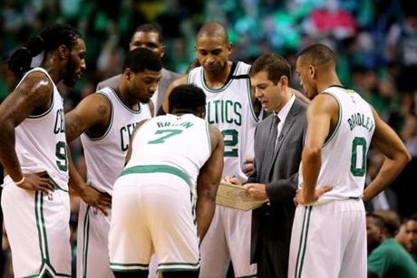 BOSTON, MA - MAY 10: Head Coach Brad Stevens talks to Jaylen Brown #7, Jae Crowder #99, Marcus Smart #36, Al Horford #42 and Avery Bradley #0 of the Boston Celtics during a time out in the second half of Game Five of the Eastern Conference Semifinals against the Washington Wizards at TD Garden on May 10, 2017 in Boston, Massachusetts. The Celtics defeat the Wizards 123-101. NOTE TO USER: User expressly acknowledges and agrees that, by downloading and or using this Photograph, user is consenting to the terms and conditions of the Getty Images License Agreement. (Photo by Maddie Meyer/Getty Images)
