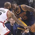Cleveland Cavaliers forward LeBron James (23) goes head-to-head against Toronto Raptors forward P.J. Tucker (2) during first half NBA playoff basketball action in Toronto on Sunday, May 7, 2017. (Frank Gunn/The Canadian Press via AP)