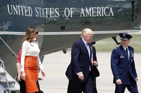 First lady Melania Trump Trump, left, President Donald Trump, and US Air Force Col. Casey D. Eaton, Commander, 89th Airlift Wing, walk to Air Force One at Andrews Air Force Base, Md., Friday, May 19, 2017, prior to Trump's departure on his first overseas trip. (AP Photo/Alex Brandon)
