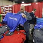 Staffers on Saturday gave away about 5,000 T-shirts, buttons, and other gear left over from past campaigns.