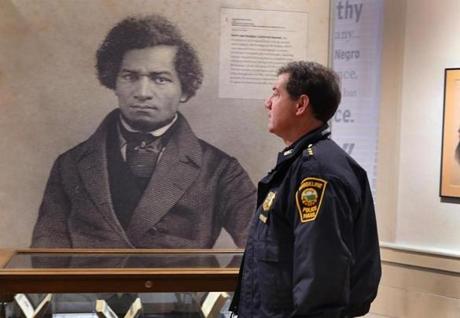 Deputy Superintendent Michael Gropman looked at a photo of Frederick Douglass at the Museum of African American History.
