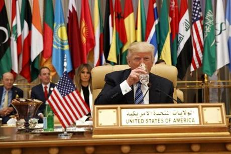President Donald Trump took a drink of water before delivering a speech to the Arab Islamic American Summit, at the King Abdulaziz Conference Center on Sunday. 
