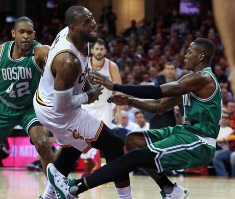 Cleveland, OH May 23, 2017: Cleveland's LeBron James (left) was called for an offensive foul on this second quarter drive to the hoop vs. the Celtics Terry Rozier (right). It was his fourth foul of the game, and he was taken out right after this play. The Boston Celtics played Game Four of their NBA Eastern Conference Finals playoff series vs. the Cleveland Cavaliers at the Quicken Loans Arena. (Globe Staff Photo/Jim Davis) 
