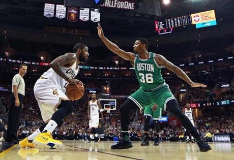 Cleveland, OH May 21, 2017: The Celtics Marcus Smart (36) defends against the Cavaliers Kyrie Irving. The Boston Celtics visited the Cleveland Cavaliers for Game Three of their NBA Eastern Conference Finals playoff series at the Quicken Loans Arena. (Globe Staff Photo/Jim Davis) 

