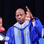 J. Keith Motley acknowledged a standing ovation in his honor at his last commencement as chancellor.