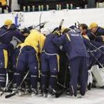 Nashville Predators players and coaches gather together at the end of a practice at their NHL hockey facility Thursday, May 25, 2017, in Nashville, Tenn. (AP Photo/