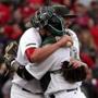 Boston, MA - 5/27/2017 - (9th inning) Boston Red Sox starting pitcher Brian Johnson (61) shares an embrace with Boston Red Sox catcher Sandy Leon (3) following his complete game shutout over the Seattle Mariners. The Boston Red Sox host the Seattle Mariners in the second of a three game series at Fenway Park. - (Barry Chin/Globe Staff), Section: Sports, Reporter: Peter Abraham, Topic: 28Sox-Mariners, LOID: 8.3.2575145591.