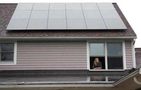 Irene Kneeland (above) and her husband installed solar panels on the roof of their home in Sutton.
