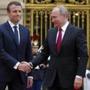 Russian President Vladimir Putin, right, is welcomed by French President Emmanuel Macron at the Palace of Versailles, near Paris, France, Monday, May 29, 2017. Monday's meeting comes in the wake of the Group of Seven's summit over the weekend where relations with Russia were part of the agenda, making Macron the first Western leader to speak to Putin after the talks. (AP Photo/Alexander Zemlianichenko, pool)