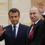 French President Emmanuel Macron and Russian President Vladimir Putin greeted journalists at the Palace of Versailles on May 29, 2017.e first Western leader to speak to Putin after the talks. (AP Photo/Alexander Zemlianichenko, pool)